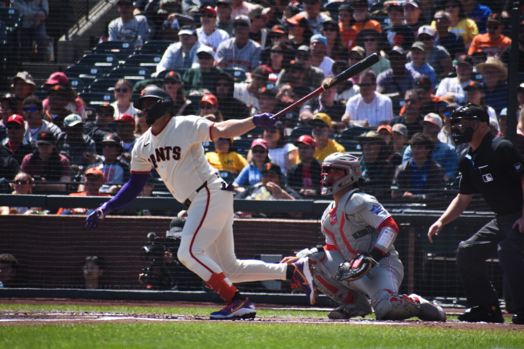 Willy Adames hits a fly ball against Aaron Nola