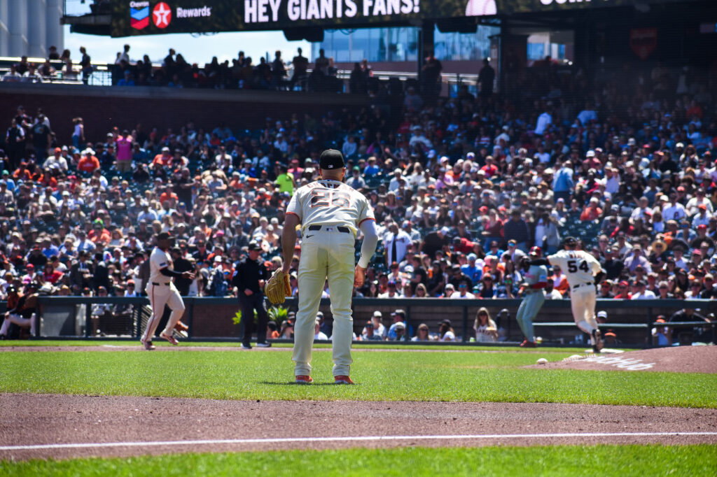 Matt Chapman watching a play unfold at first base