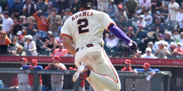 Willy Adames rounds third to score against the Philles