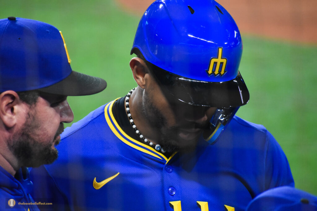 Julio and coach prepping for at-bat, Giants - Mariners, T-Mobile Park 2024
