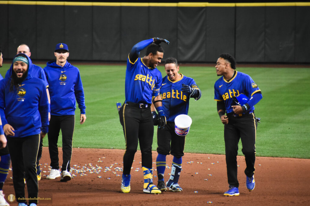Mariners poor bubble gum all over the infield after a victory, Giants - Mariners, T-Mobile Park 2024