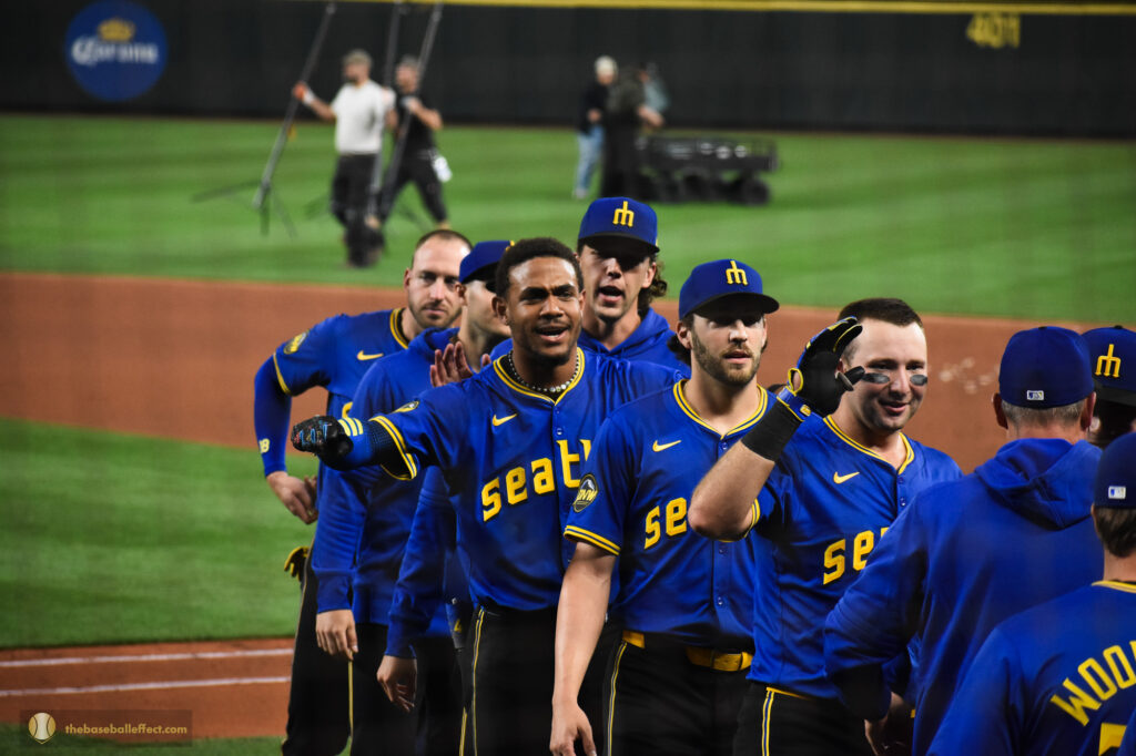 Mariners shake hands and high-five after a win, Giants - Mariners, T-Mobile Park 2024