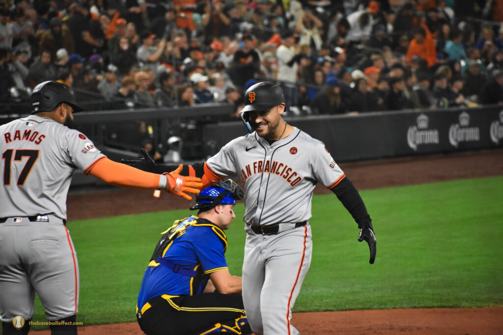 Heliot Ramos greet his teammate Michael Conforto after hitting a homerun, T-Mobile Park 2024