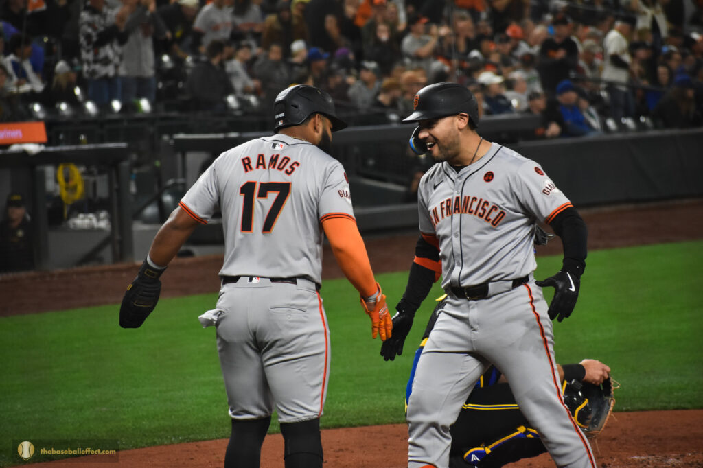 Ramos and Conforto smiling after scoring, T-Mobile Park 2024