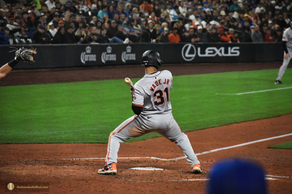 Lamonte Wade Jr. ducks out of the way of an inside pitch, T-Mobile Park 2024